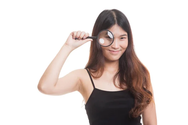 Young Asian woman with a magnifying glass. — Stock Photo, Image