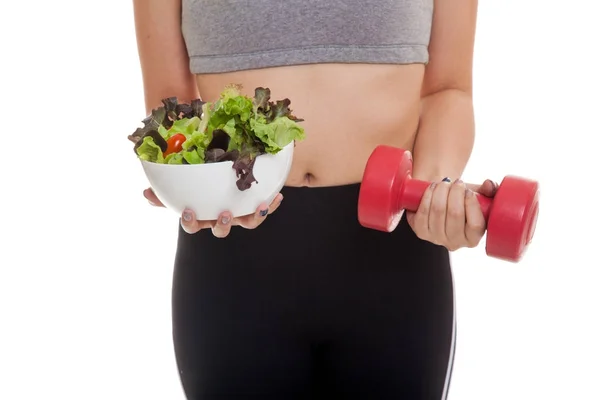 Asian healthy girl with dumbbell and salad. — Stock Photo, Image