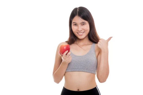 Hermosa chica sana asiática pulgares arriba con manzana . — Foto de Stock