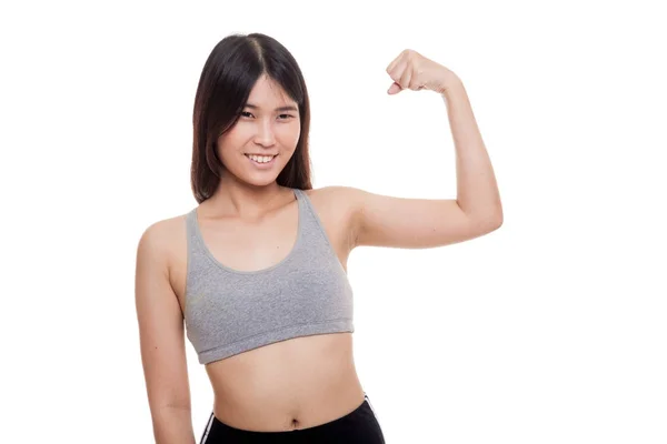 Hermosa joven asiática mujer en deporte vestidos flex bíceps . —  Fotos de Stock