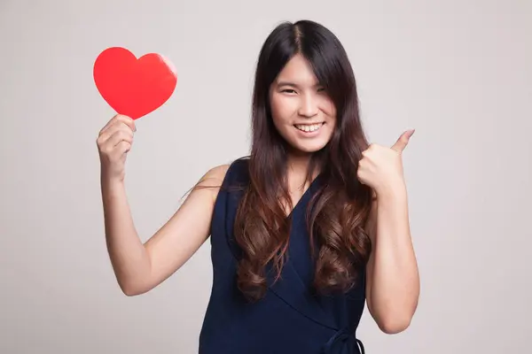 Asian woman thumbs up with red heart. — Stock Photo, Image