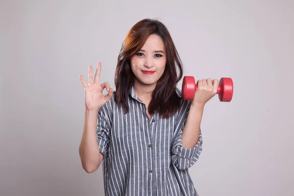 Healthy Asian woman show OK with dumbbells. — Stock Photo, Image