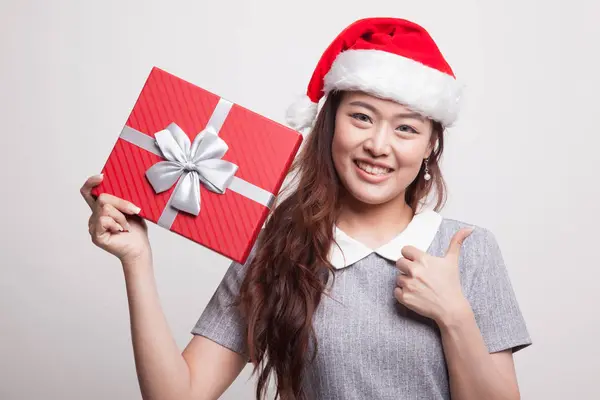 Junge asiatische Frau Daumen nach oben mit einem Geschenk-Box. — Stockfoto