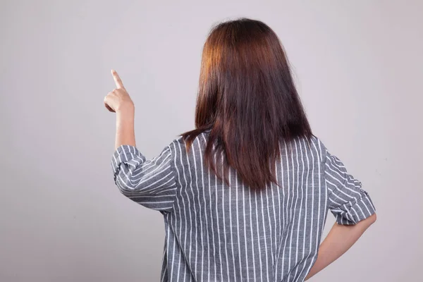 Back of Asian woman touching the screen with her finger. — Stock Photo, Image