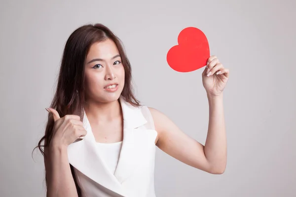 Asian woman thumbs up with red heart. — Stock Photo, Image