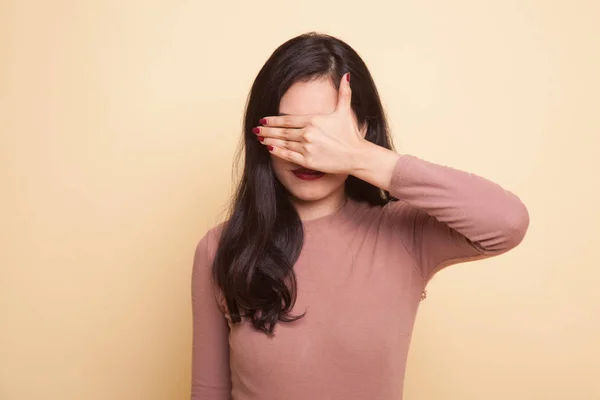 Young Asian woman close her eyes with hand. — Stock Photo, Image