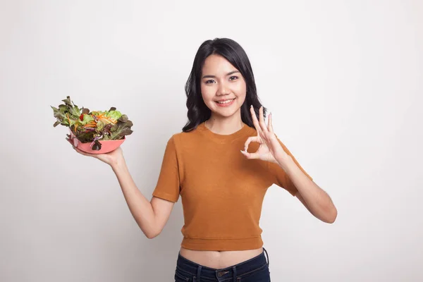 Healthy Asian woman show OK with salad. — Stock Photo, Image