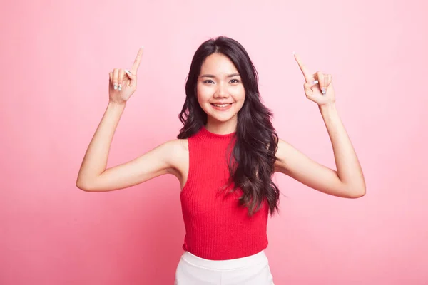 Young Asian woman point to blank space. — Stock Photo, Image