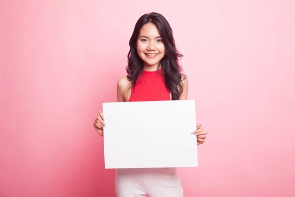 Young Asian woman with white blank sign. — Stock Photo, Image