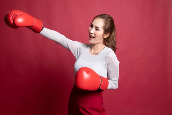 Young Asian woman with red boxing gloves.