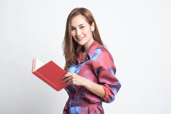 Young Asian woman with a book. — Stock Photo, Image