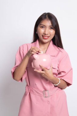 Sikke ve domuz para banka ile Asyalı kadın.