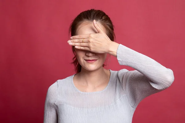 Young Asian woman close her eyes with hand. — Stock Photo, Image