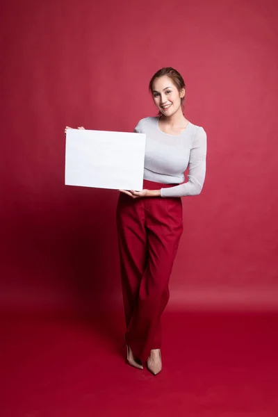 Full body of young Asian woman with white blank sign.