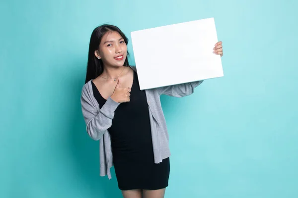 Young Asian woman show thumbs up with  white blank sign. — Stock Photo, Image