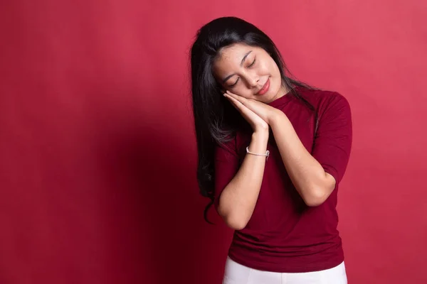 Beautiful young Asian woman with sleeping gesture. — Stock Photo, Image