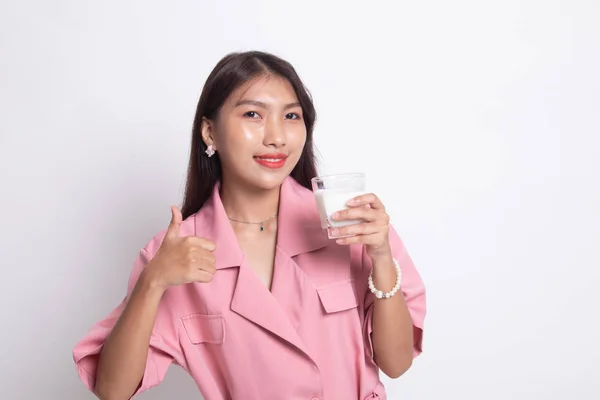 Healthy Asian woman drinking a glass of milk thumbs up. — Stock Photo, Image