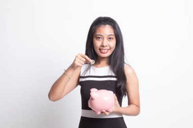 Sikke ve domuz para banka ile Asyalı kadın.