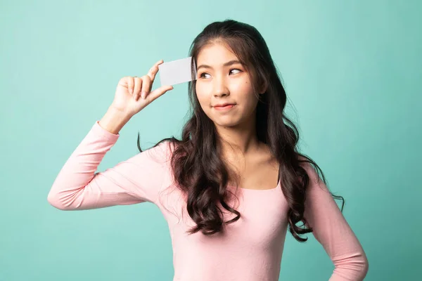 Young Asian Woman Think Blank Card Cyan Background — 스톡 사진