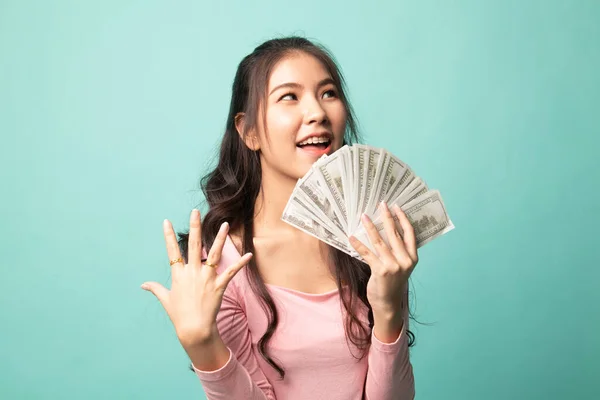 Portrait Young Asian Woman Showing Bunch Money Banknotes Cyan Background — Stock Photo, Image