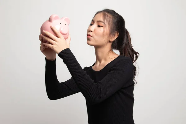 Young Asian Woman Kiss Pink Coin Bank White Background — Stock Photo, Image