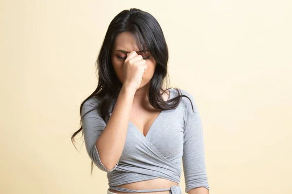 Young Asian Woman Got Sick Headache Beige Background — Stock Photo, Image