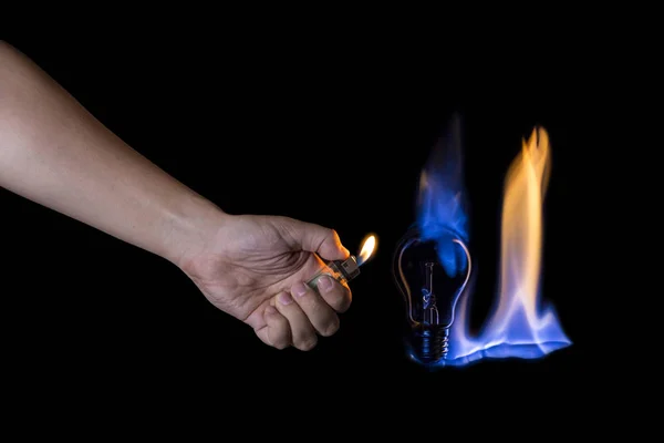 Hand lighting a lightbulb instead a candle — Stock Photo, Image