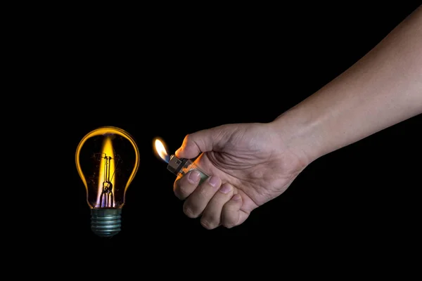 Mão acendendo uma lâmpada em vez de uma vela — Fotografia de Stock