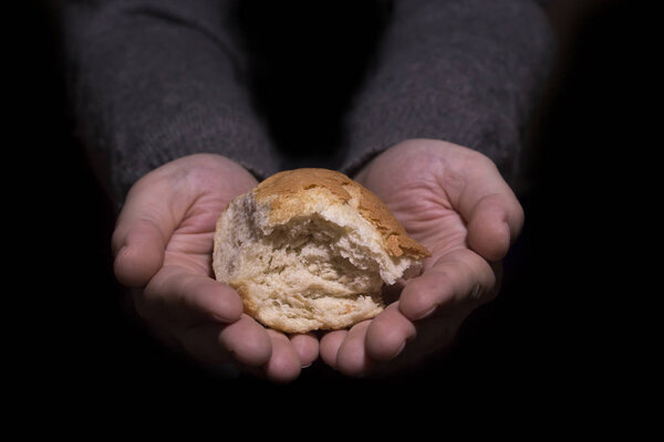 Sharing bread. Poverty concept.