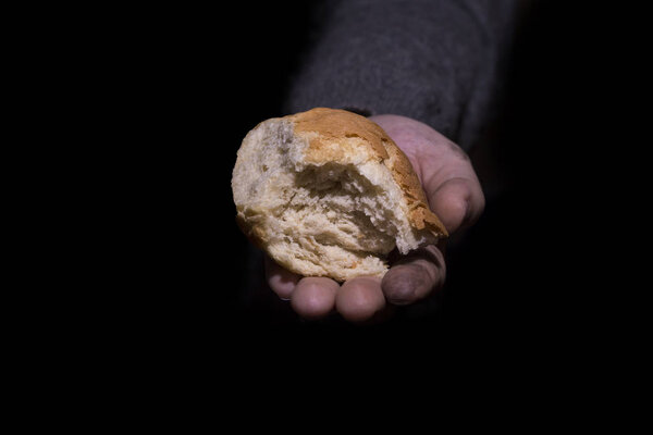 Giving bread. Poverty concept.