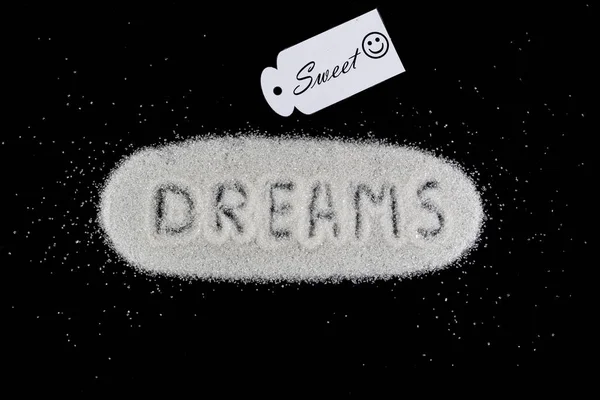 Biały cukier z marzeń słowo. Koncepcja słodkie sny. — Zdjęcie stockowe