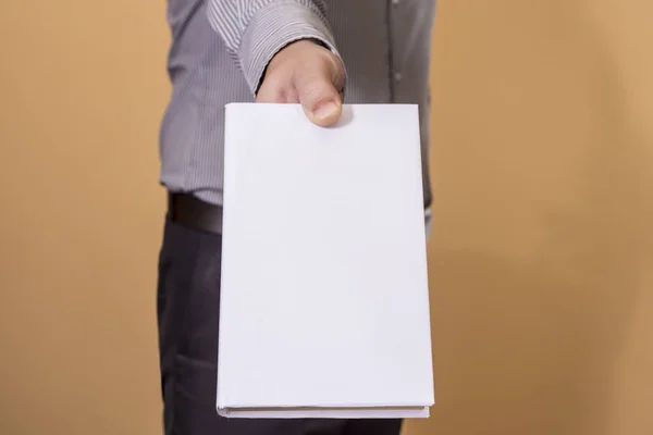 Man holding a blank book — Stock Photo, Image