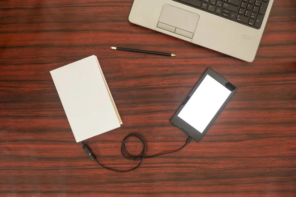 Tablet connected to a book. Data transfer. — Stock Photo, Image