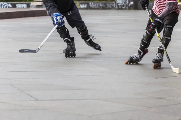 People playing street hockey with sticks and rollers — Zdjęcie stockowe
