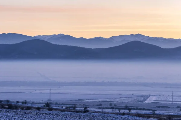 City covered by the fog during sunset — Stock Photo, Image