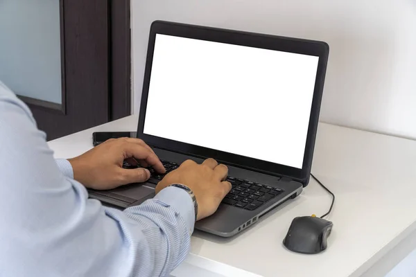 Business man typing on a laptop keyboard