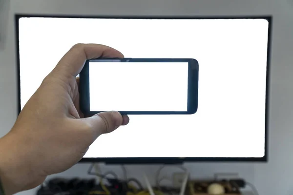 Seeing only through a screen concept. Man holding phone in front — 스톡 사진