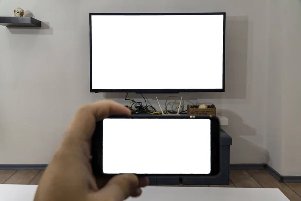 Cast smartphone on a tv concept — Stock Photo, Image