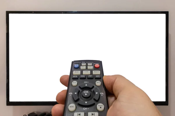 Person Pointing Remote Pressing Buttons Front Blank Screen — Stock Photo, Image