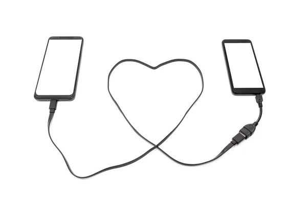 Hand Connecting Two Smartphones Heart Shaped Usb Cable Long Distance — Stock Photo, Image