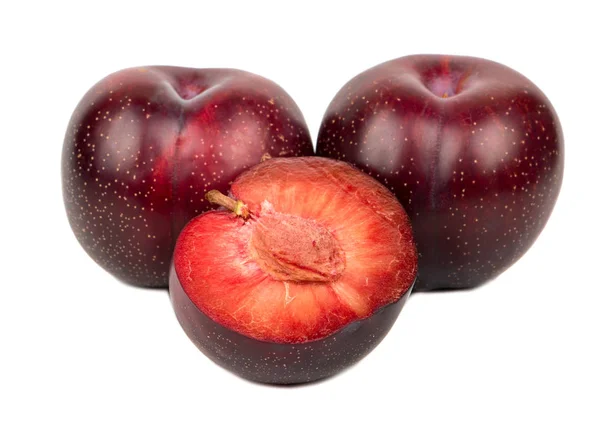 Red plum with half — Stock Photo, Image