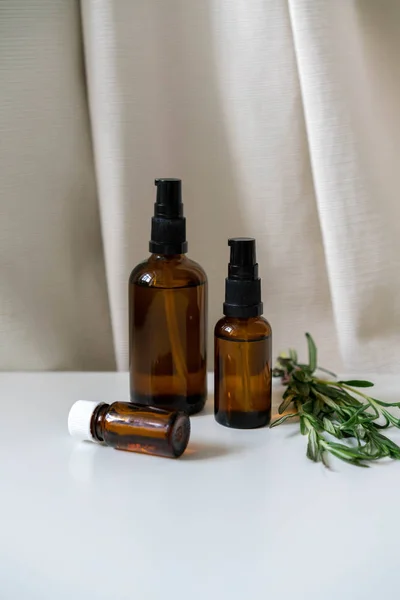 Aromatherapy Concept Photo Bottles Essential Oils Fresh Rosemary Herb Vertical — Stock Photo, Image