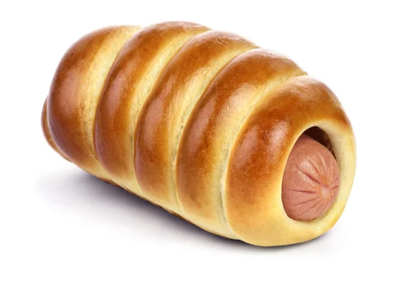 Sausage in ruddy yeast bun — Stock Photo, Image