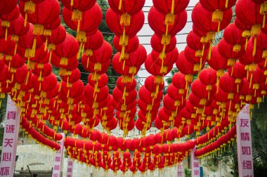 Mass of red lanterns spherical shape hanging above the passage (Singapore) clipart