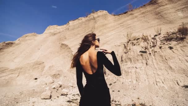Pretty woman in long black dress — Stock Video