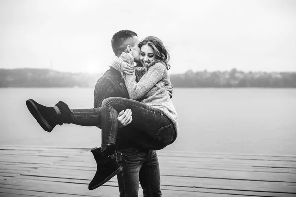 Young boy holding his girl in arms — Stock Photo, Image