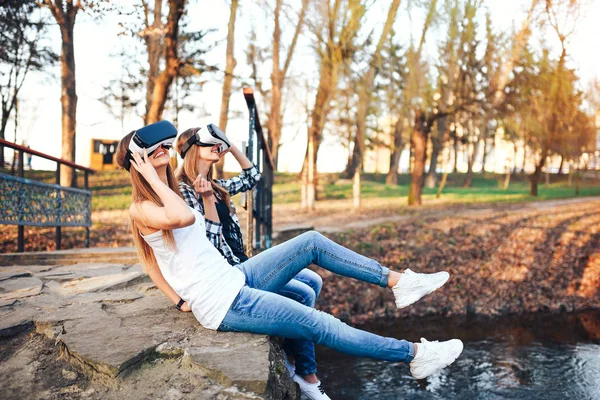 girls enjoying virtual reality glasses