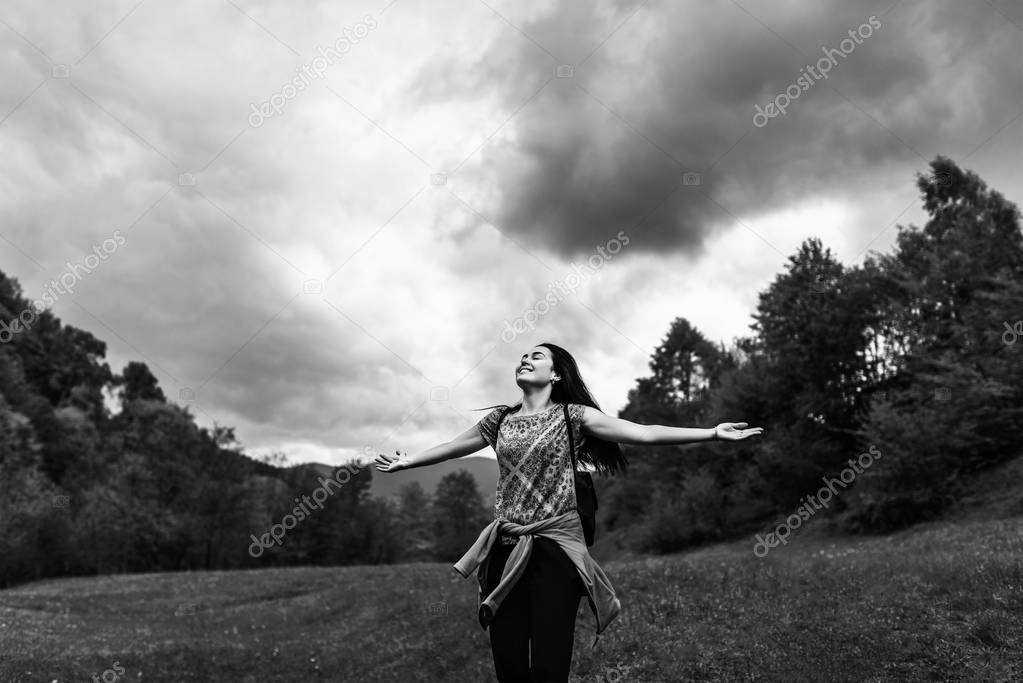 Woman with cloudy sky