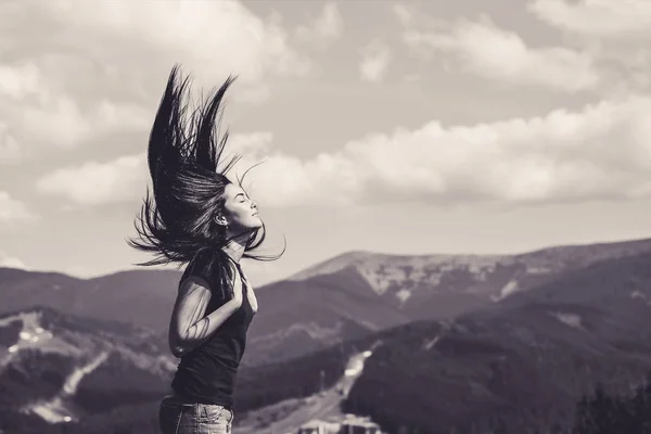 Brunette girl on the top of the mountain — Stock Photo, Image