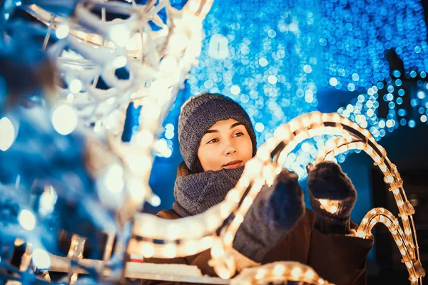 Dreamy woman with christmas lights — Stock Photo, Image